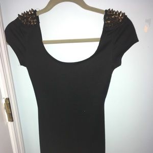 Black cocktail dress with gold studded shoulders